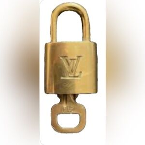 Louis Vuitton Gold Padlock with Key. Authentic. Preowned. Clean and shiny.